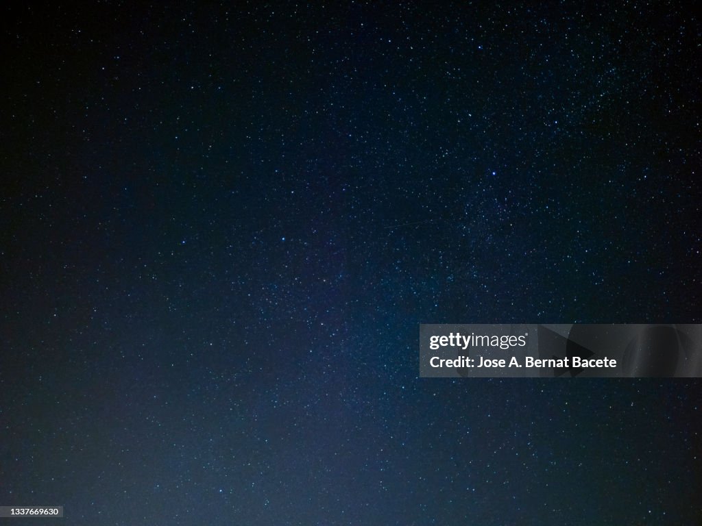 Full frame of black night sky with stars.