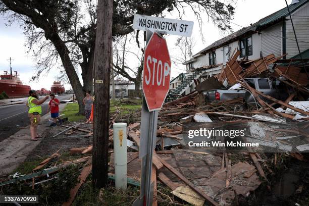 Victor Womble and his fiancee Stephanie Guidry survey their home which was severely damaged by Hurricane Ida September 1, 2021 in Golden Meadow,...