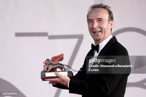 Roberto Benigni poses with the Golden Lion for lifetime Achievement received during the opening Ceremony of the 78th Venice International Film...
