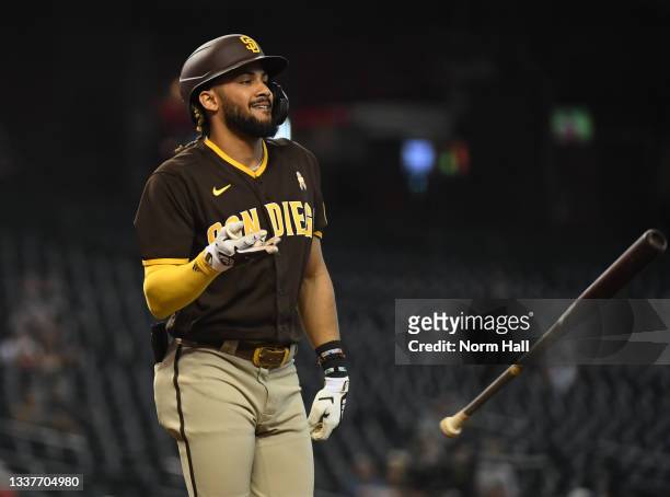 Fernando Tatis Jr of the San Diego Padres throws his bat after being called out on strikes against the Arizona Diamondbacks during the fourth inning...