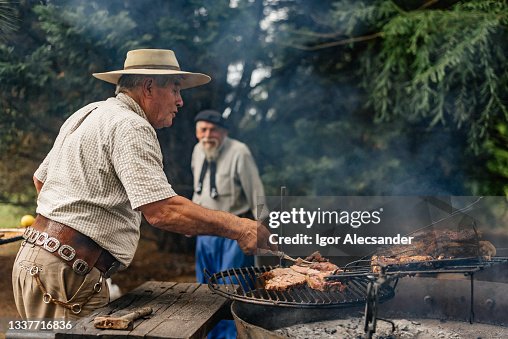 Gaucho preparing barbecue in the countryside Gaucho preparing barbecue in the countryside