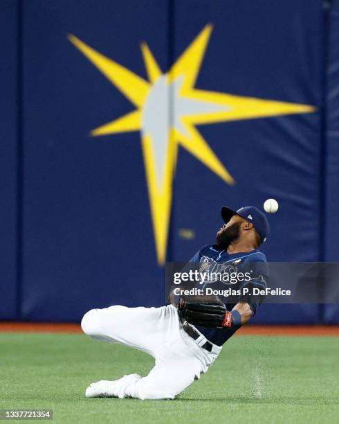 Manuel Margot of the Tampa Bay Rays attempts to catch a fly ball during the second inning against the Boston Red Sox at Tropicana Field on September...