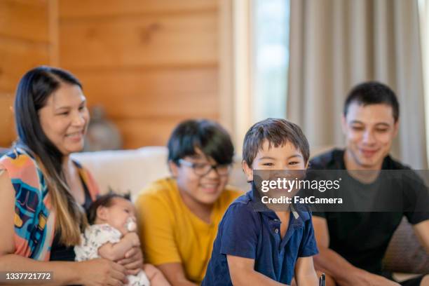 beautiful indigenous family spending quality time together at home - native american family stock pictures, royalty-free photos & images