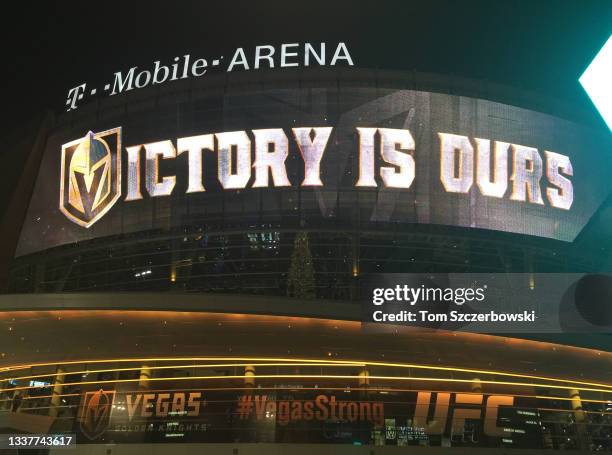Electronic monitors on the front of T-Mobile Arena display a victory message outside at night after the Vegas Golden Knights defeated the Nashville...