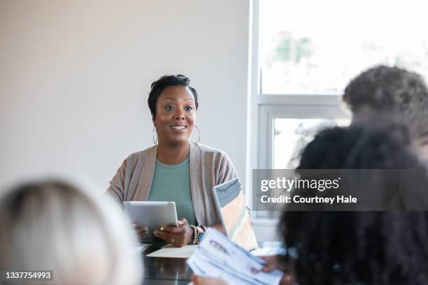 diverse business people attend training class meeting in board room - administrator stock pictures, royalty-free photos & images