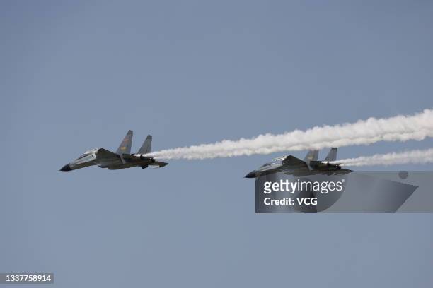 Escorted by two Chinese fighter jets, a plane carrying the remains of 109 Chinese soldiers killed in the 1950-53 Korean War lands at Shenyang Taoxian...