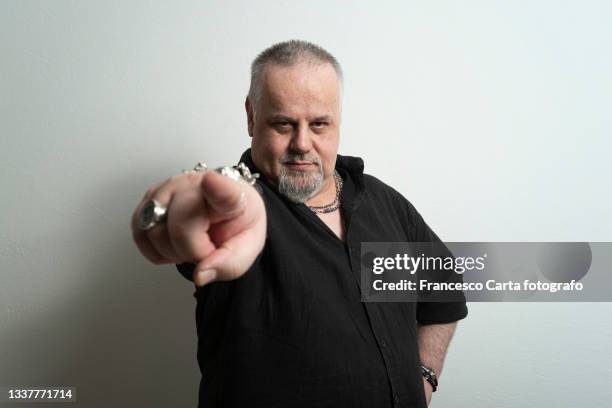 adult man  looking in camera and pointing - finger ring stock pictures, royalty-free photos & images