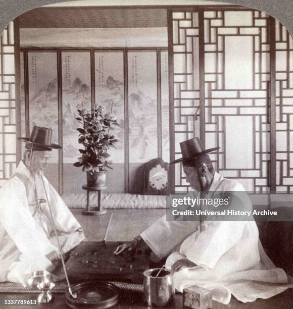 Game of 'Go-ban,' or oriental chess - Yun-Woong-Neil, Korean Minister of War , in his home.