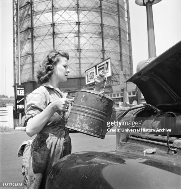 Miss Ruth Gusick, formerly a clerk in a drugstore, now works as a garage attendant at one of the Atlantic Refining Company Garages, Philadelphia,...
