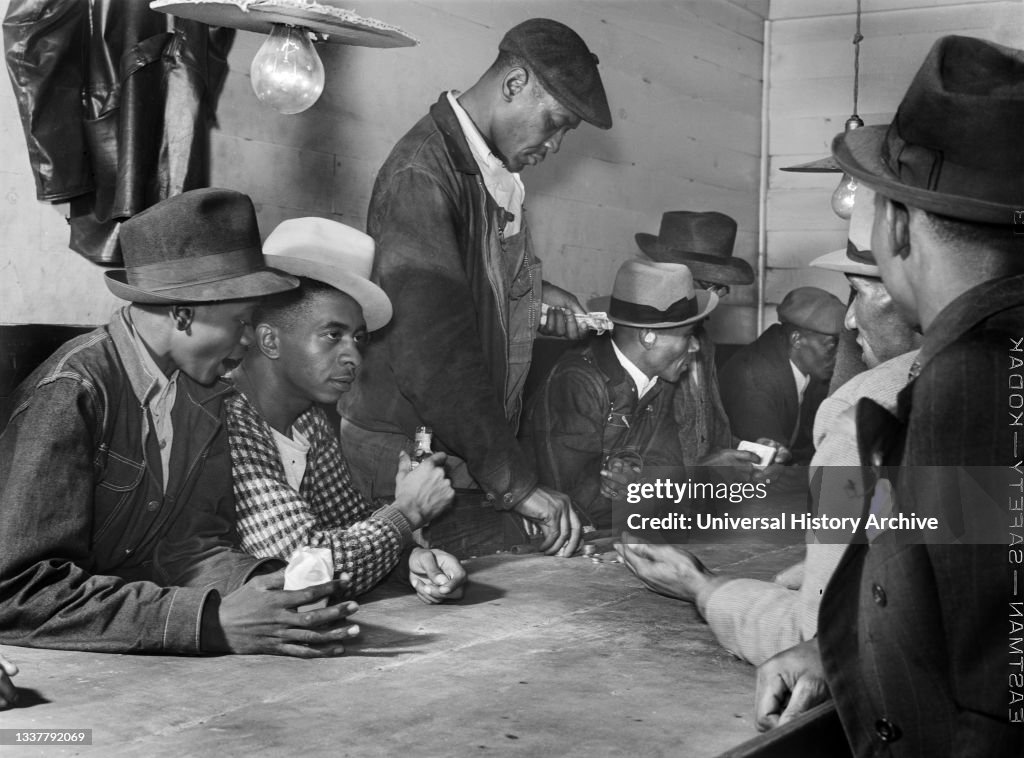 Men spending their money in Gambling and Juke Joint, Saturday night, outside Clarksdale, Mississippi, USA, Marion Post Wolcott, U.S. Farm Security Administration, November 1939