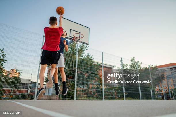 another day on a basketball court - basketball blocking shot stock pictures, royalty-free photos & images