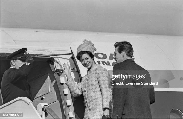 Princess Margaret with her husband Antony Armstrong-Jones, 1st Earl of Snowdon at London Airport , UK, 4th November 1965. They are en route to San...