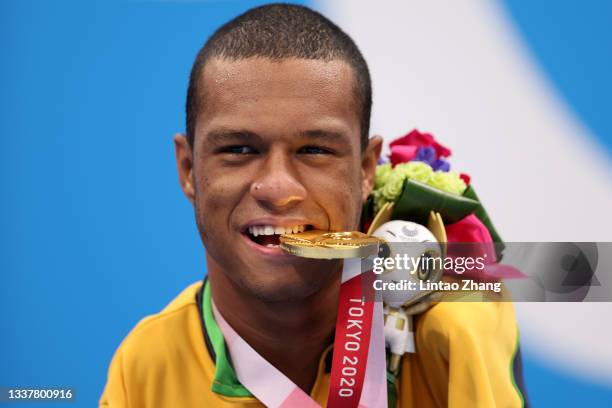 Gold medalist Gabriel Geraldo dos Santos Araujo of Team Brazil celebrates on the podium at the medal ceremony for the Men's 50m Backstroke - S2 on...