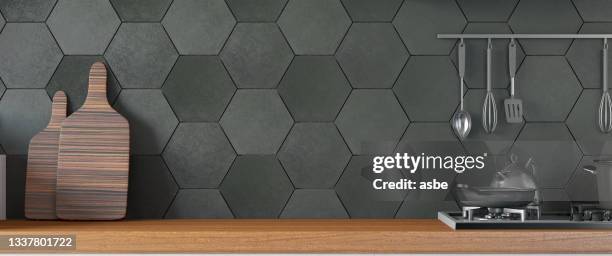 black kitchen design with counter and empty wall - dark kitchen stock pictures, royalty-free photos & images