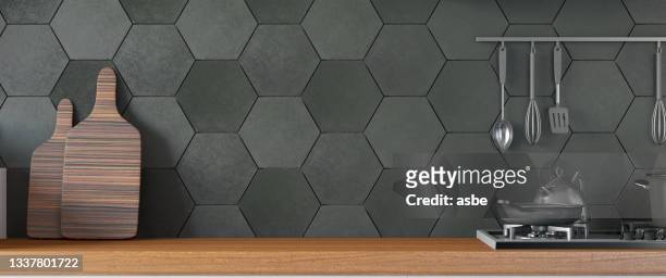 black kitchen design with counter and empty wall - front view bildbanksfoton och bilder