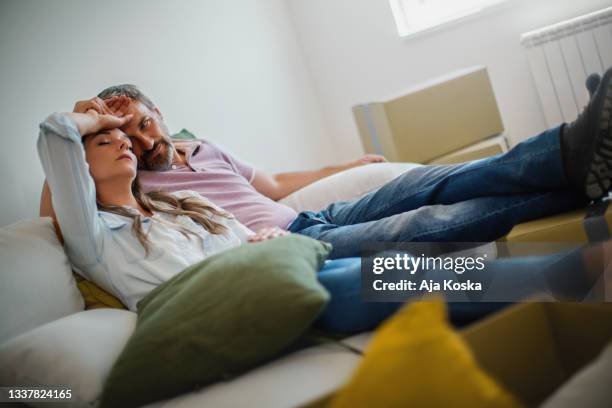 couple moving into a new apartment. - tired couple stock pictures, royalty-free photos & images