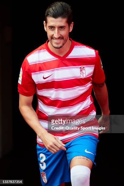 Sergio Escudero jumps into the pitch during his unveiling as new player of Granada CF at Estadio Nuevo Los Carmenes on September 02, 2021 in Granada,...