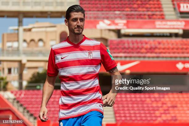 Sergio Escudero poses on the pitch for the media during his unveiling as new player of Granada CF at Estadio Nuevo Los Carmenes on September 02, 2021...