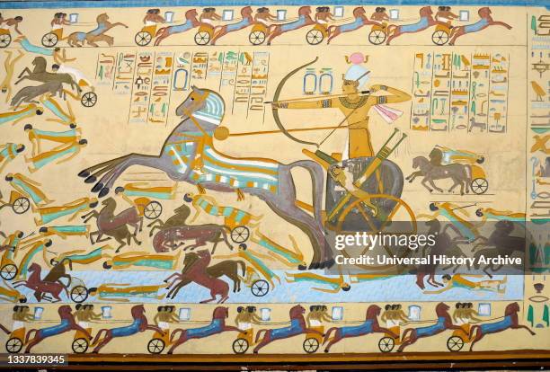 Reconstruction of a painted fresco depicting a battle scene in ancient Egypt. A Pharaoh defeats his enemies in a massive chariot led onslaught. The...