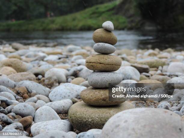 close-up of stacked stones on field - ahmed alghamdi stock pictures, royalty-free photos & images