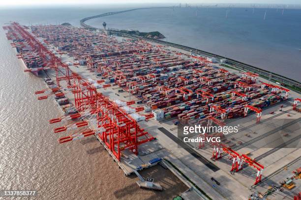 Aerial view of shipping containers sitting stacked at Yangshan Deepwater Port, the world's biggest automated container terminal, on August 30, 2021...