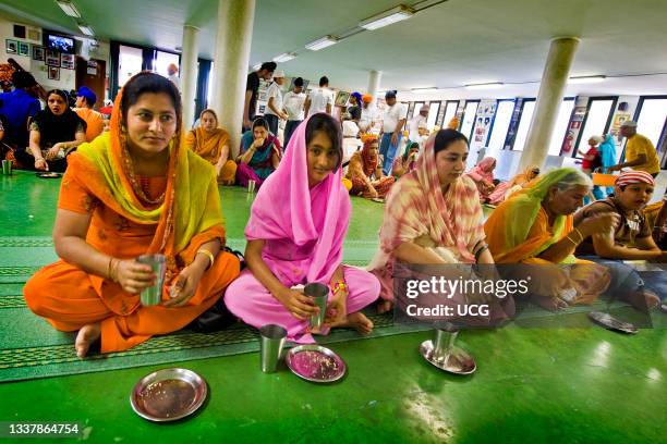 Lunch time in the temple. Sikh community. Sikhdharma Gurdwara Singh Sabha Association. Novellara. Reggio Emilia province. Italy.