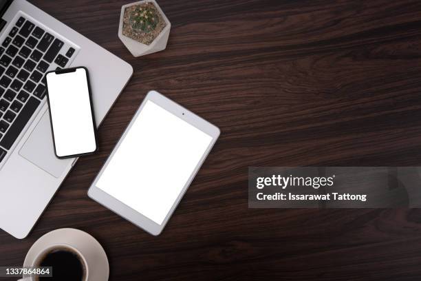 office stuff with notepad, laptop, smartphone and coffee cup top view shot. - office desk top view fotografías e imágenes de stock