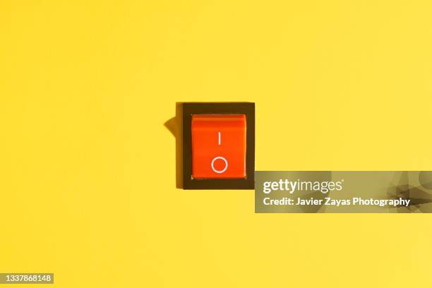 rocker switch on a yellow background. power-off position. - turning on light switch stock pictures, royalty-free photos & images