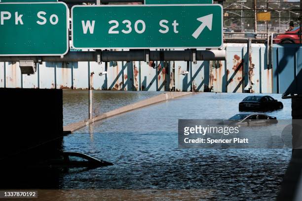 Cars sit abandoned on the flooded Major Deegan Expressway following a night of extremely heavy rain from the remnants of Hurricane Ida on September...