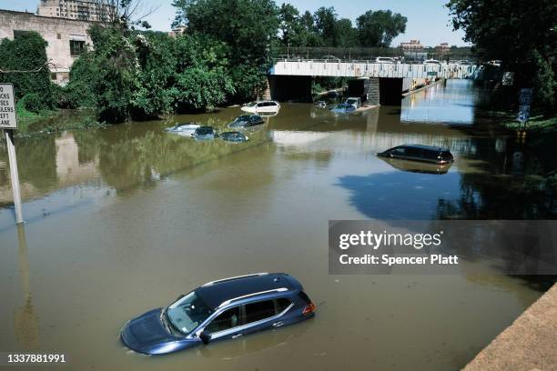 Cars sit abandoned on the flooded Major Deegan Expressway following a night of extremely heavy rain from the remnants of Hurricane Ida on September...