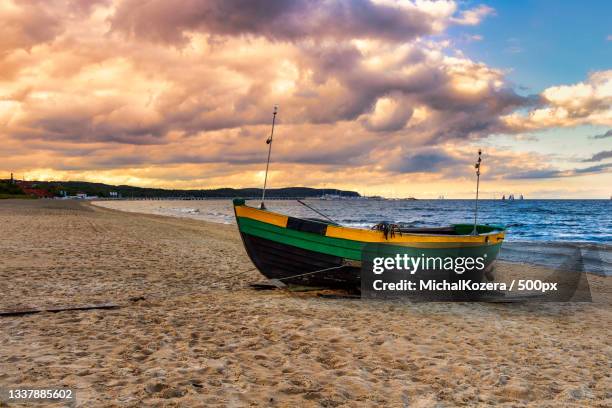 scenic view of beach against sky during sunset,sopot,poland - baltic sea poland stock pictures, royalty-free photos & images