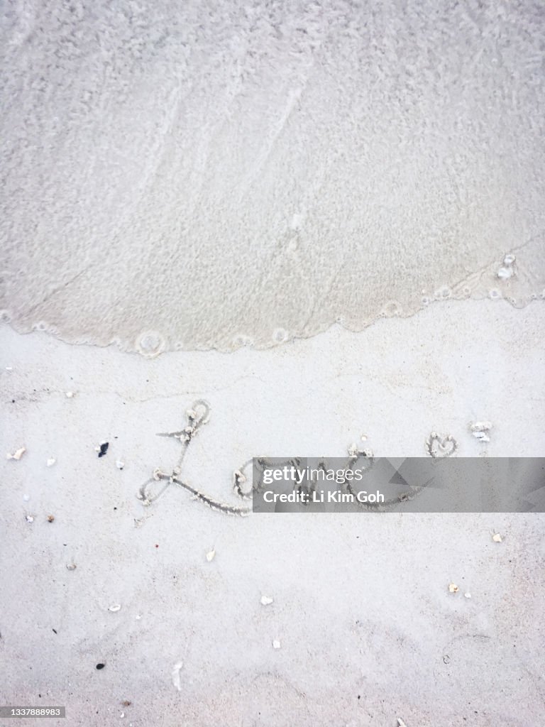 Love text on beach