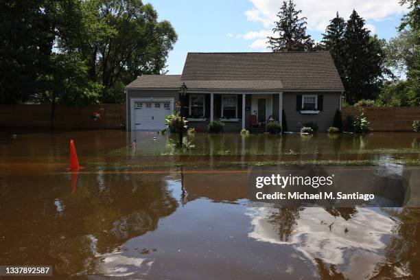 River water floods the front of a home on West Williams Street Road on September 02, 2021 in Lincoln Park, New Jersey. NJ Gov. Phil Murphy declared a...