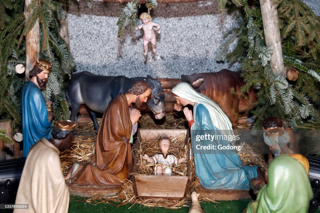 Catholic Scene Nativity scene. Christmas crib. Holy family with baby Jesus. Catholic ...
