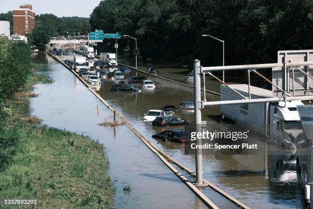 Cars sit abandoned on the flooded Major Deegan Expressway in the Bronx following a night of heavy wind and rain from the remnants of Hurricane Ida on...