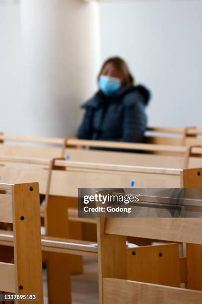 Saint Paul church. Woman with surgical mask. Covid 19 pandemic. Annecy. France.