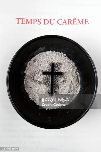 Catholic mass. Ash wednesday celebration. Ashes and lectionary. Lent season. Catholic church. France.