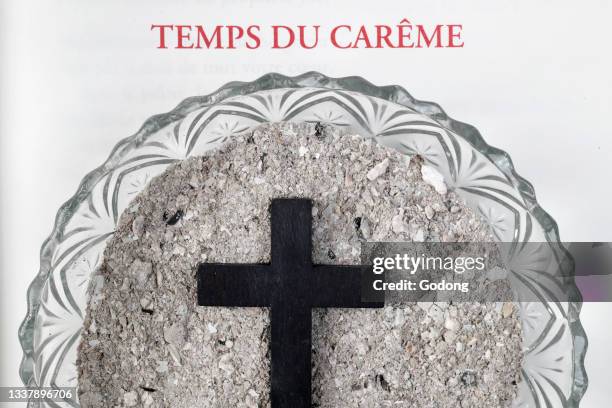 Catholic mass. Ash wednesday celebration. Ashes and lectionary. Lent season. Catholic church. France.