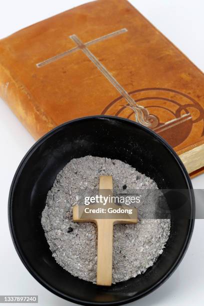 Catholic mass. Ash wednesday celebration. Ashes and lectionary. Lent season. Catholic church. France.