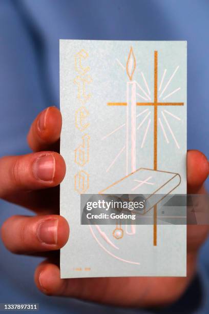 Creed image in hand. The earliest creed in Christianity, Jesus is Lord, originated in the writings of Saint Paul. France.