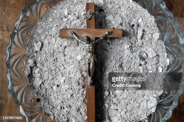 Crucifix with ashes. Ash Wednesday. Lent season. France.