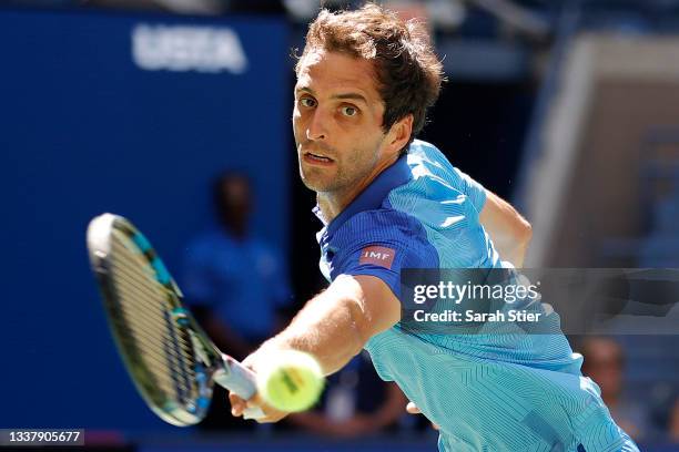 Albert Ramos-Vinolas of Spain returns the ball against Alexander Zverev of Germany during his Men's Singles second round match on Day Four of the...