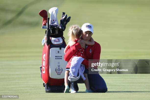 Stacy Lewis United States Assistant Captain and her daughter Chesnee look on during a practice round ahead of the start of The Solheim Cup at...