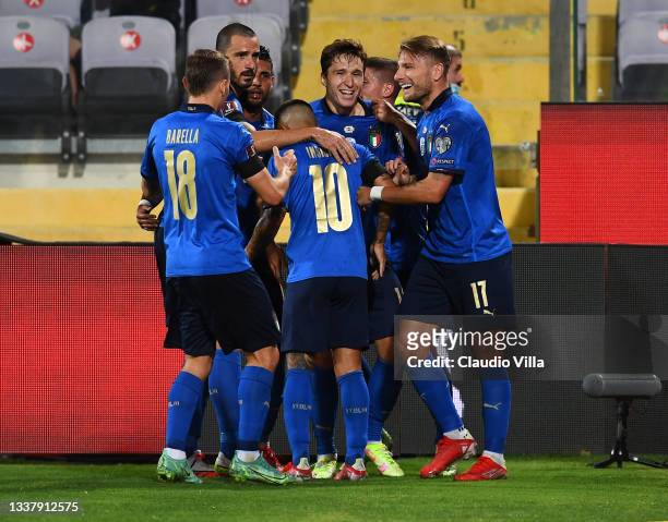Federico Chiesa of Italy celebrate with team-mates after scoring the opening goal during the 2022 FIFA World Cup Qualifier match between Italy and...