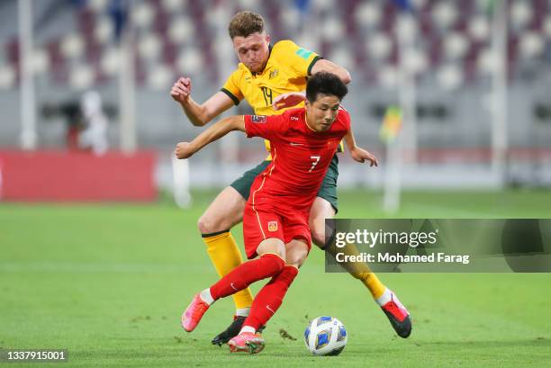 Harry Souttar of Australia and Wu Lei of China PR battle for the ball during the 2022 FIFA World Cup Qualifier match between Australia and China PR...