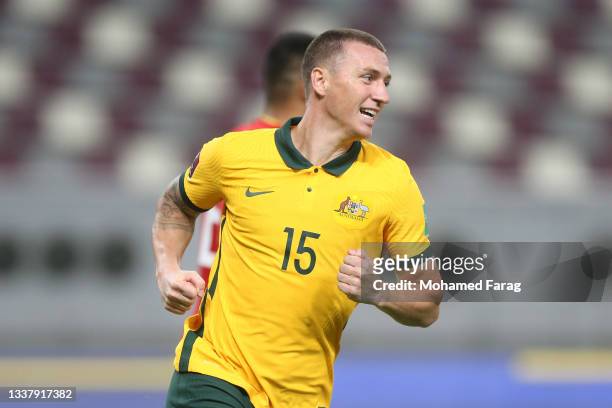 Mitchell Duke of Australia celebrates after scoring their team's third goal during the 2022 FIFA World Cup Qualifier match between Australia and...