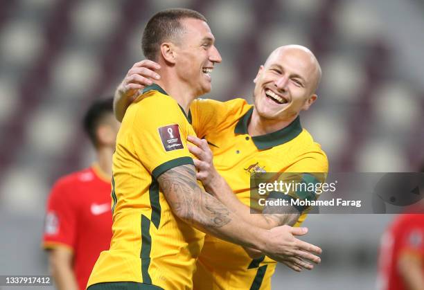 Mitchell Duke of Australia celebrates after scoring their team's third goal during the 2022 FIFA World Cup Qualifier match between Australia and...