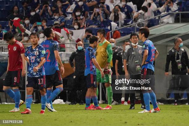 Japan head coach Hajime Morimoto and his players show dejection after FIFA World Cup Asian Qualifier Final Round Group B match between Japan and Oman...