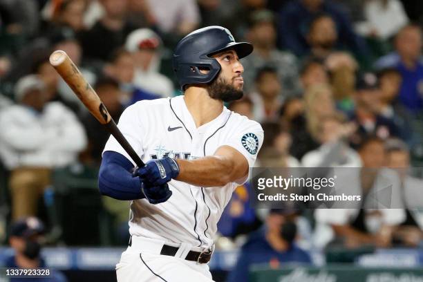 Abraham Toro of the Seattle Mariners watches his grand slam home run during the eighth inning against the Houston Astros at T-Mobile Park on August...