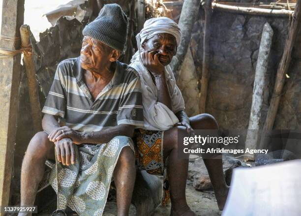 An old couple of pygmies sitting in their kitchen in their village in the middle of the forest in Ikobey , May 03, 2014. Un vieux couple de pygmees...